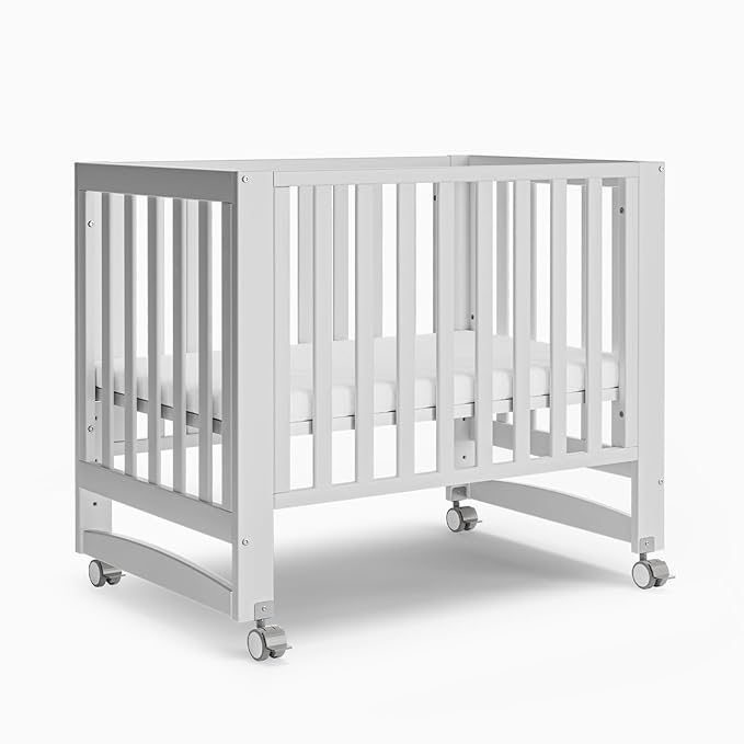 EvoNest Baby Crib, 6 in 1 Convertible Mini Crib with Wheels, 100% New Zealand Pinewood Growing Bed, 4 Adjustable Mattress Height， (Milk)